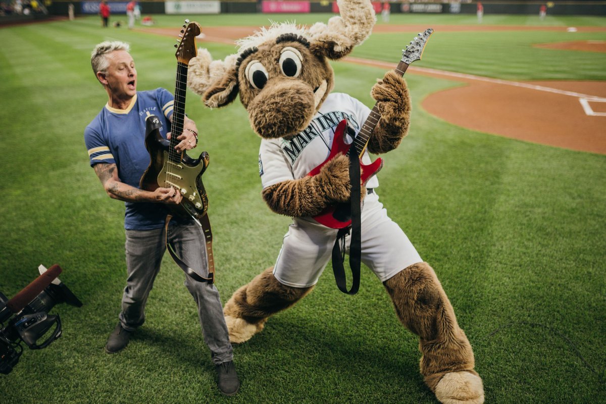 mariner moose playing guitar with friend